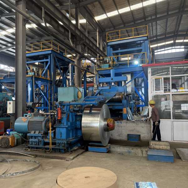 Steel strip coils loaded and strapped inside a standard shipping container