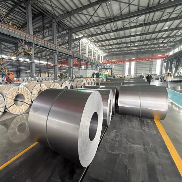 Quality inspector measuring thickness tolerance of SPCC cold rolled steel coil.