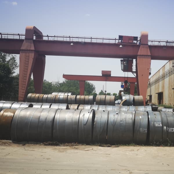 Multiple high strength hot rolled steel coils stored at port yard