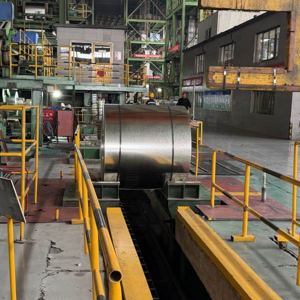 Factory technician measuring regular spangle GI coil dimensions